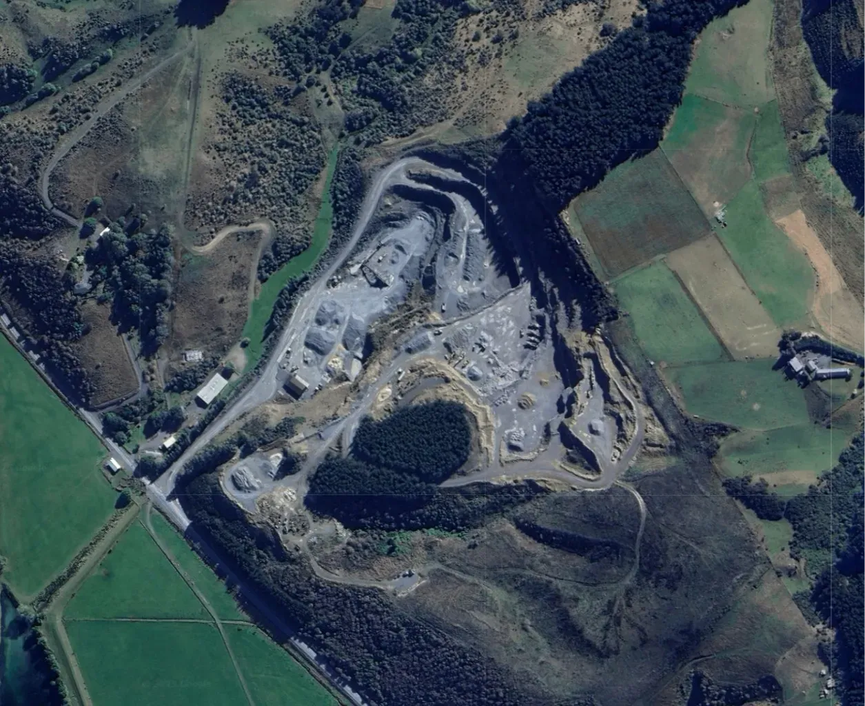 Aerial view of Blackhead Quarries’ South Otago extraction site, showing the quarry pit, stockpiles, and surrounding farmland.