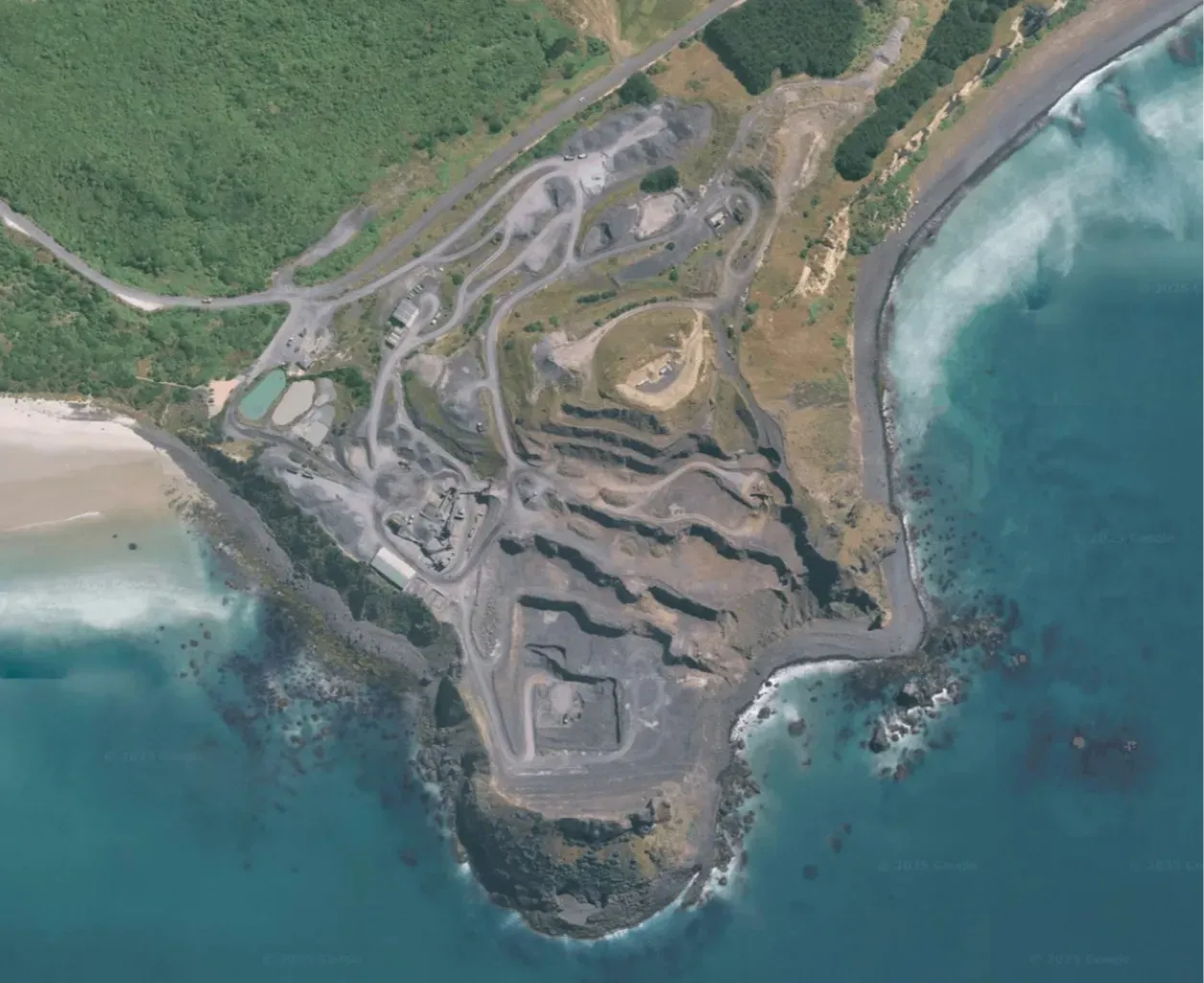Aerial view of Blackhead Quarries’ Blackhead site, showing stepped coastal quarry faces, processing areas and surrounding shoreline.