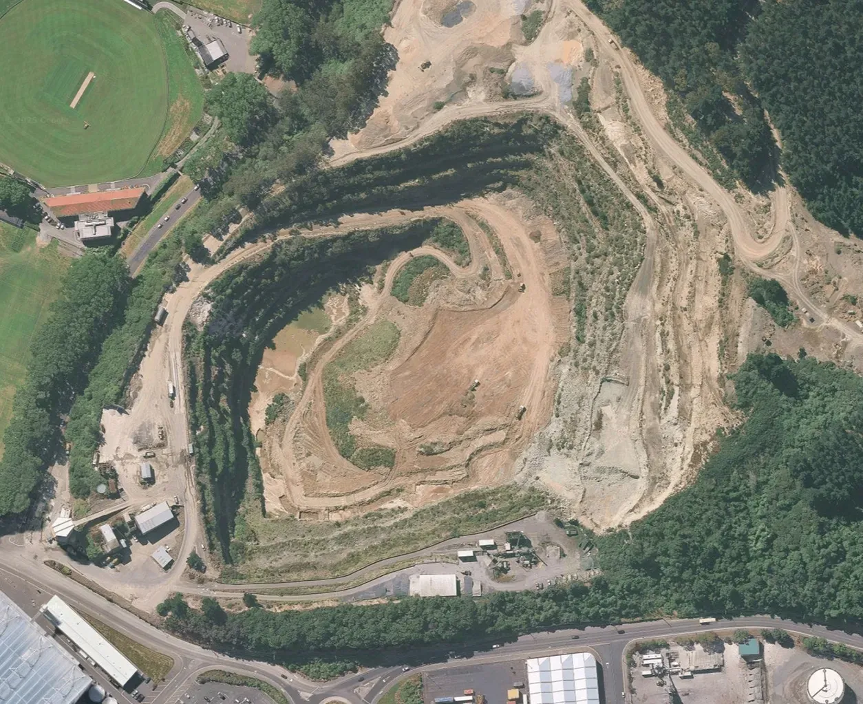 Aerial view of Blackhead Quarries’ Logan Point site, showing quarry benches, extraction areas and surrounding industrial and recreational land.