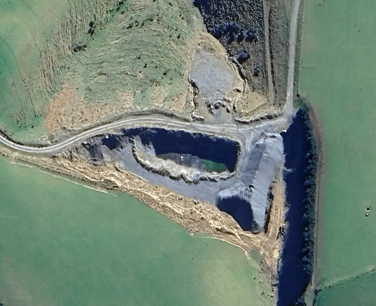 Aerial view of Blackhead Quarries’ South Otago extraction site, showing the quarry pit, stockpiles, and surrounding farmland.