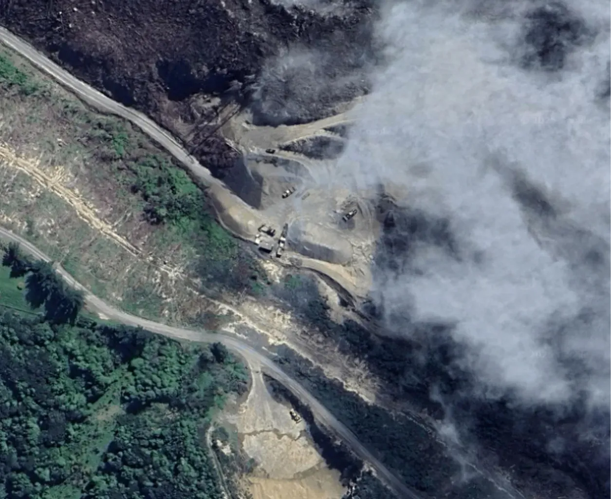 Aerial view of Blackhead Quarries’ Milton site, showing quarry machinery, access roads and surrounding vegetation with partial cloud cover.